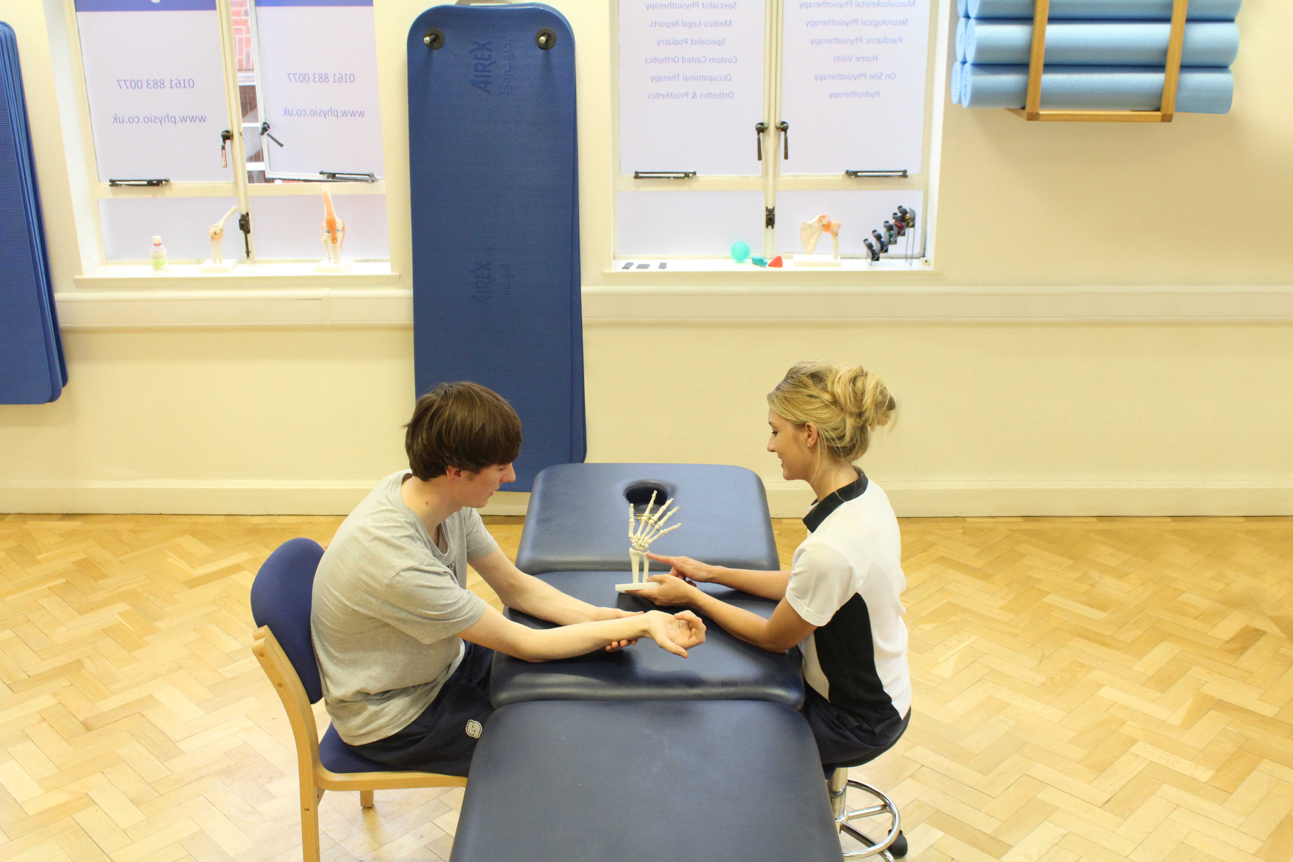 Our therapist educating her patient following a fracture to the wrist.