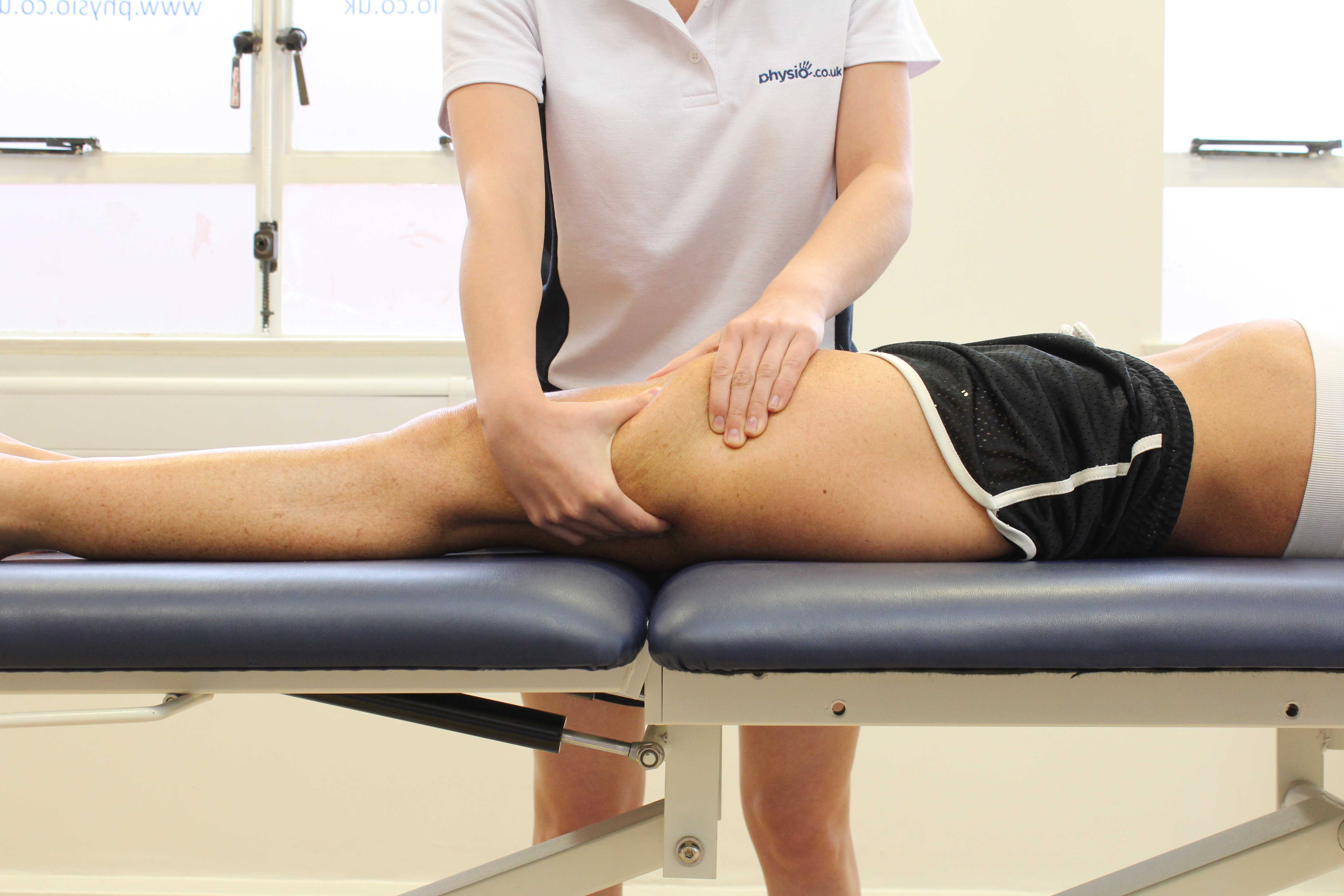 Customer receiving upper body massage while lay on side in Manchester clinic