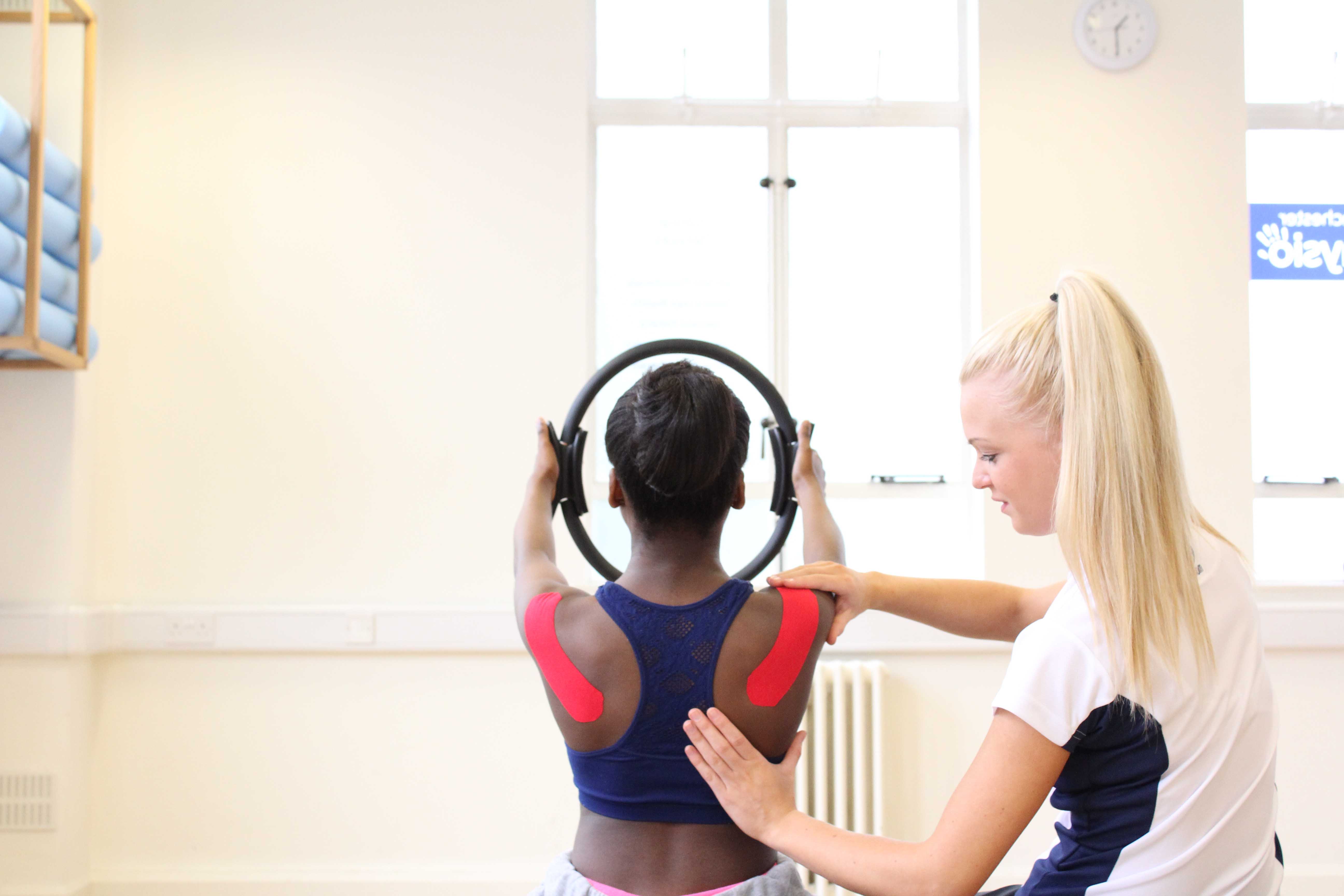 Scapular setting using taping techniques and pilates based strengthening exercises.