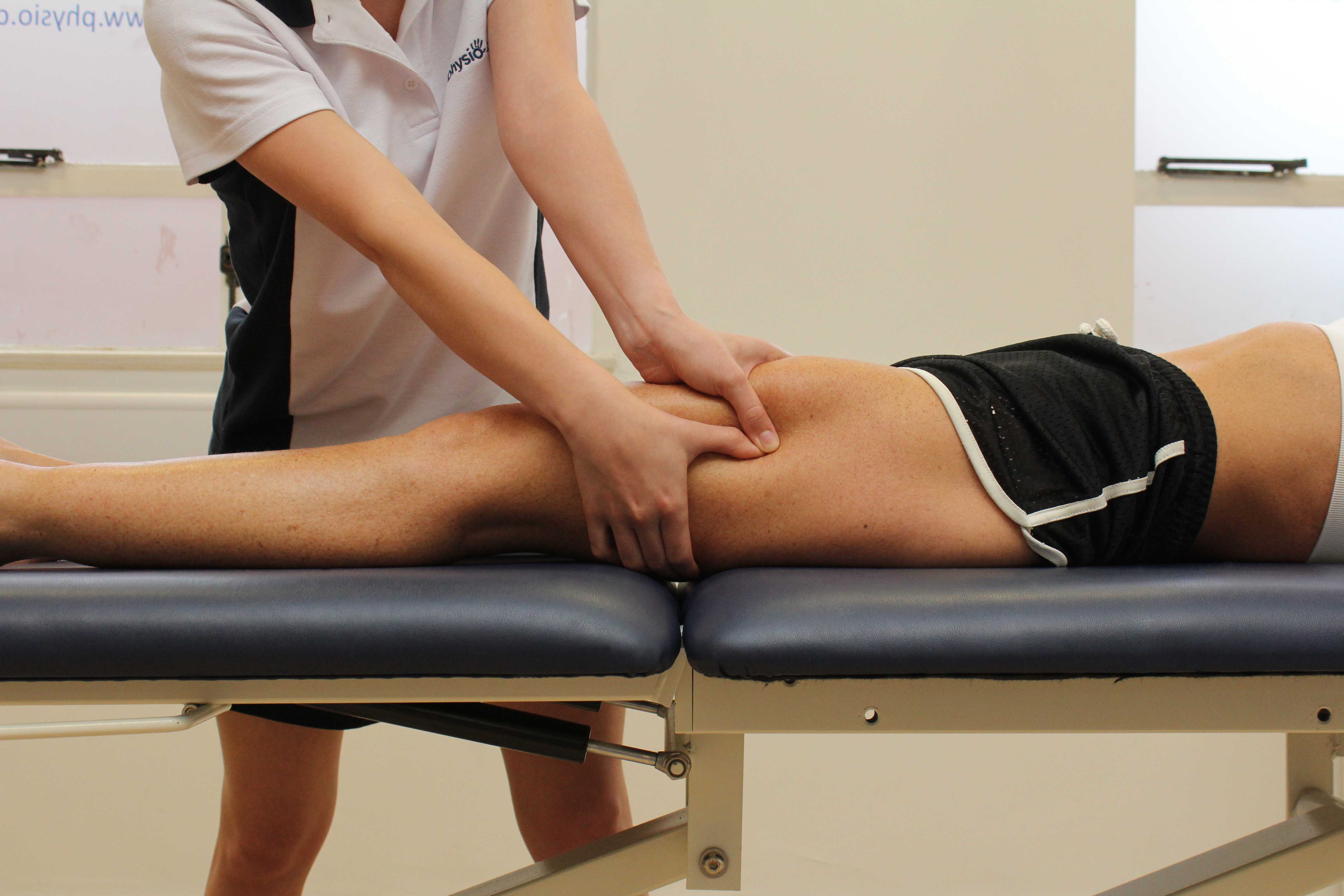 Trigger point massage technique applied to vastus lateralis 